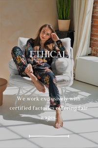 White woman wearing black pajamas sitting on a chair with her head resting against hand. "Ethical - We work exclusively with certified factories offering fair wages." is the text overlaying the image.