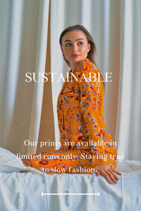 White woman wearing orange pajamas looking over her left shoulder. "Sustainable - Our prints are available in limited runs only. Staying true to slow fashion." is the text overlay for the image.